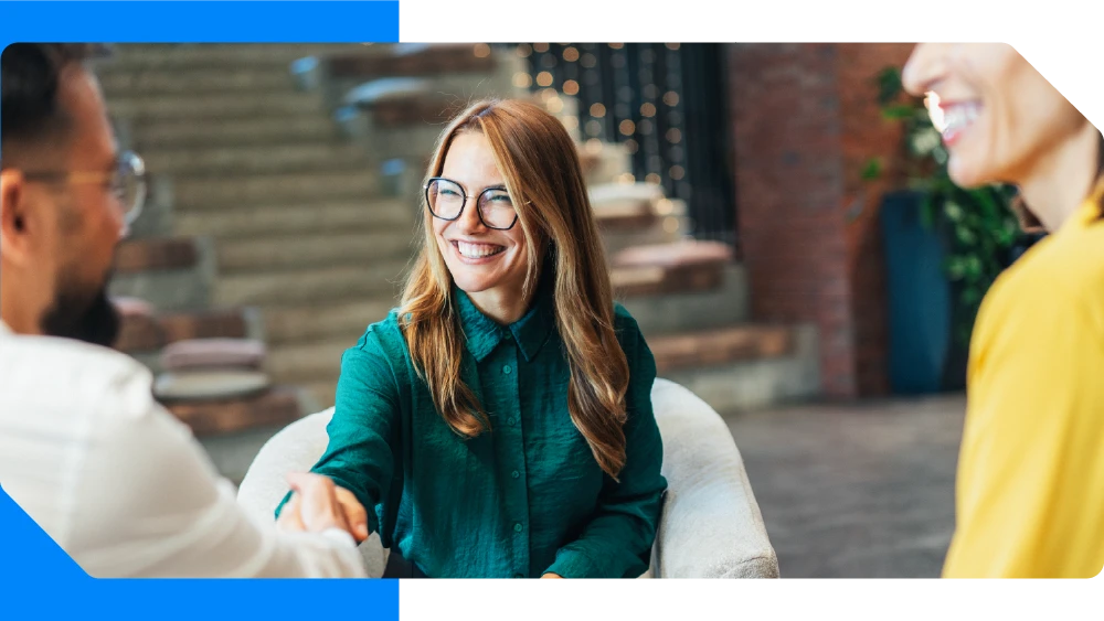 Smiling people shaking hands